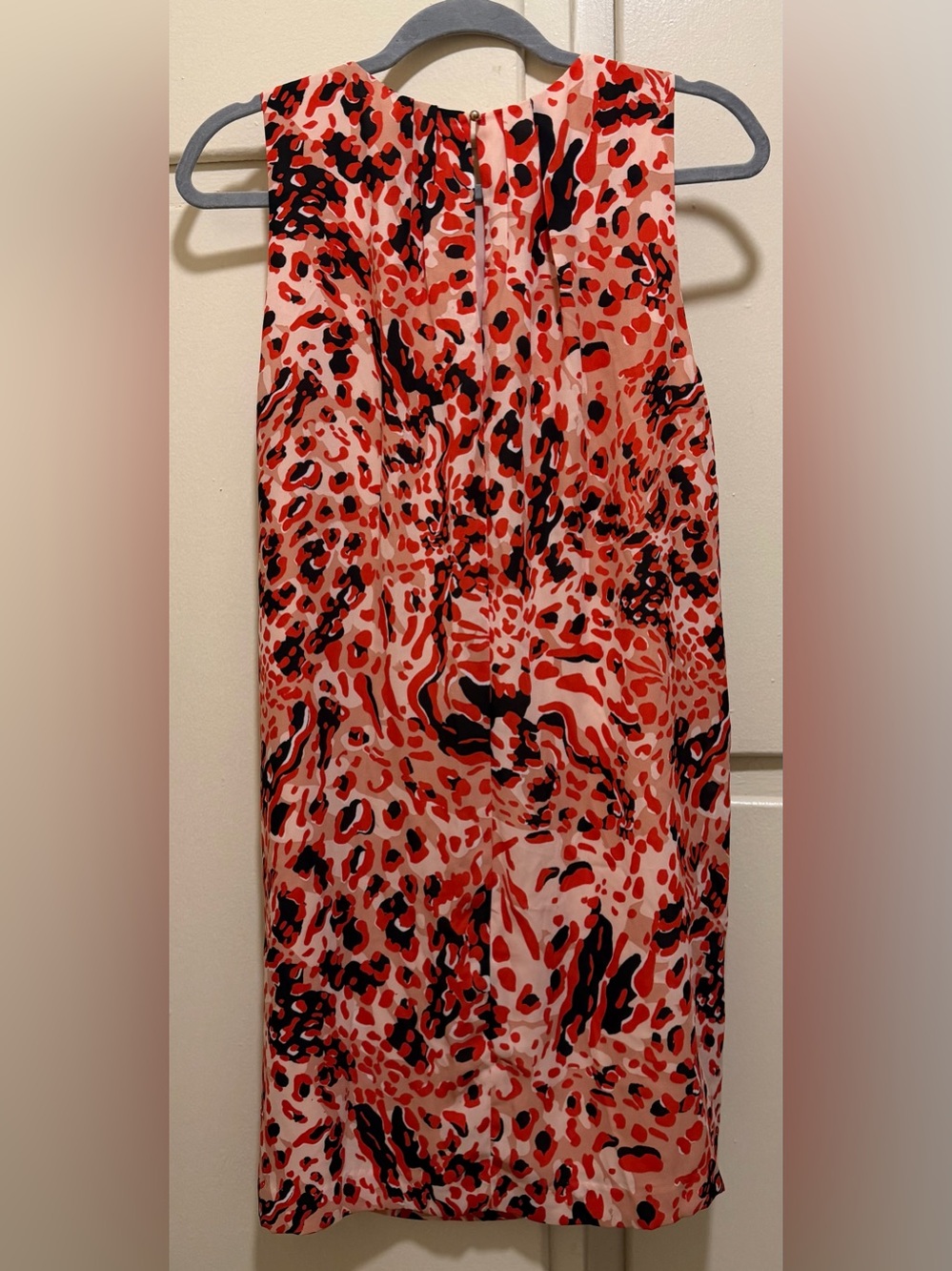 New lined lightweight size 10. Back loop closure.